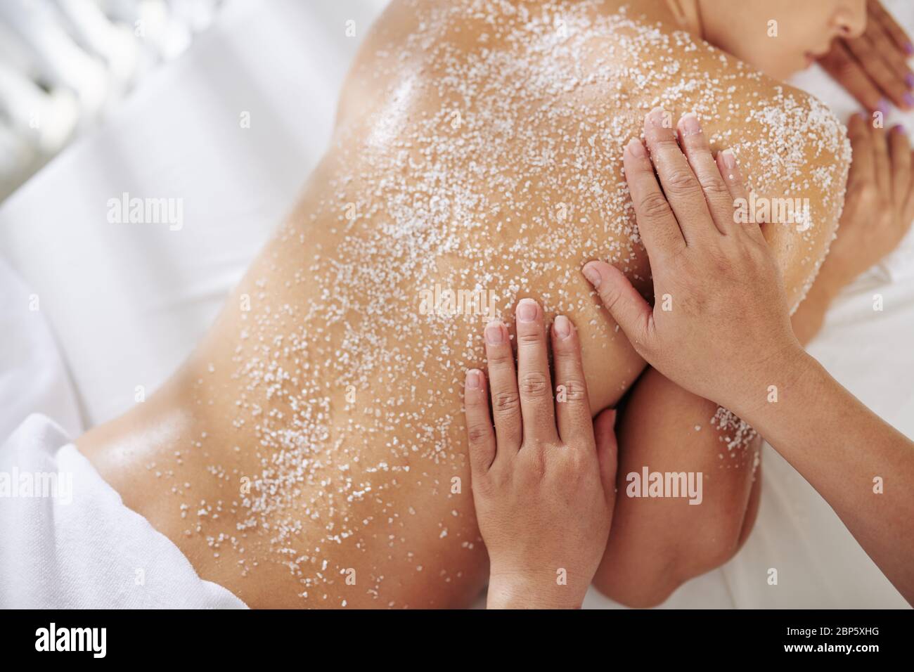 Young woman enjoying salt scrub hi-res stock photography and images - Alamy