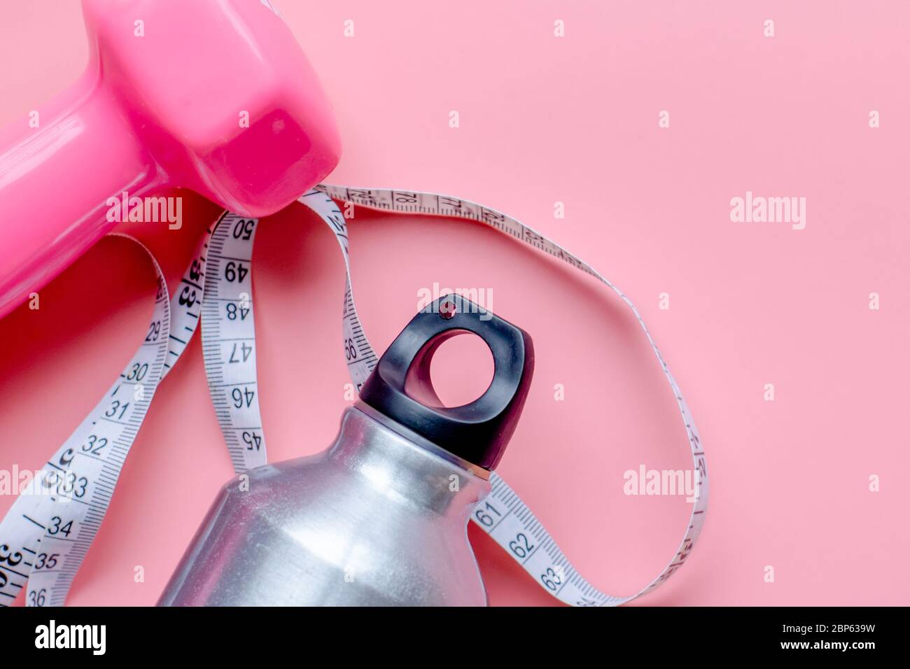 pink color dumbbell, exercise mat and water bottle on white background  4641777 Stock Photo at Vecteezy