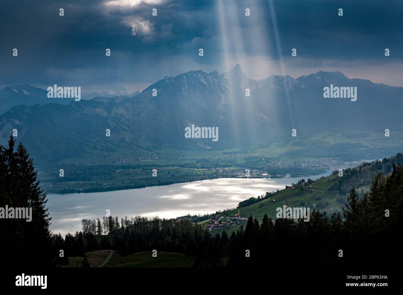 dramatic light on Lake Thun and over Thun seen from over Sigriswil Stock Photo