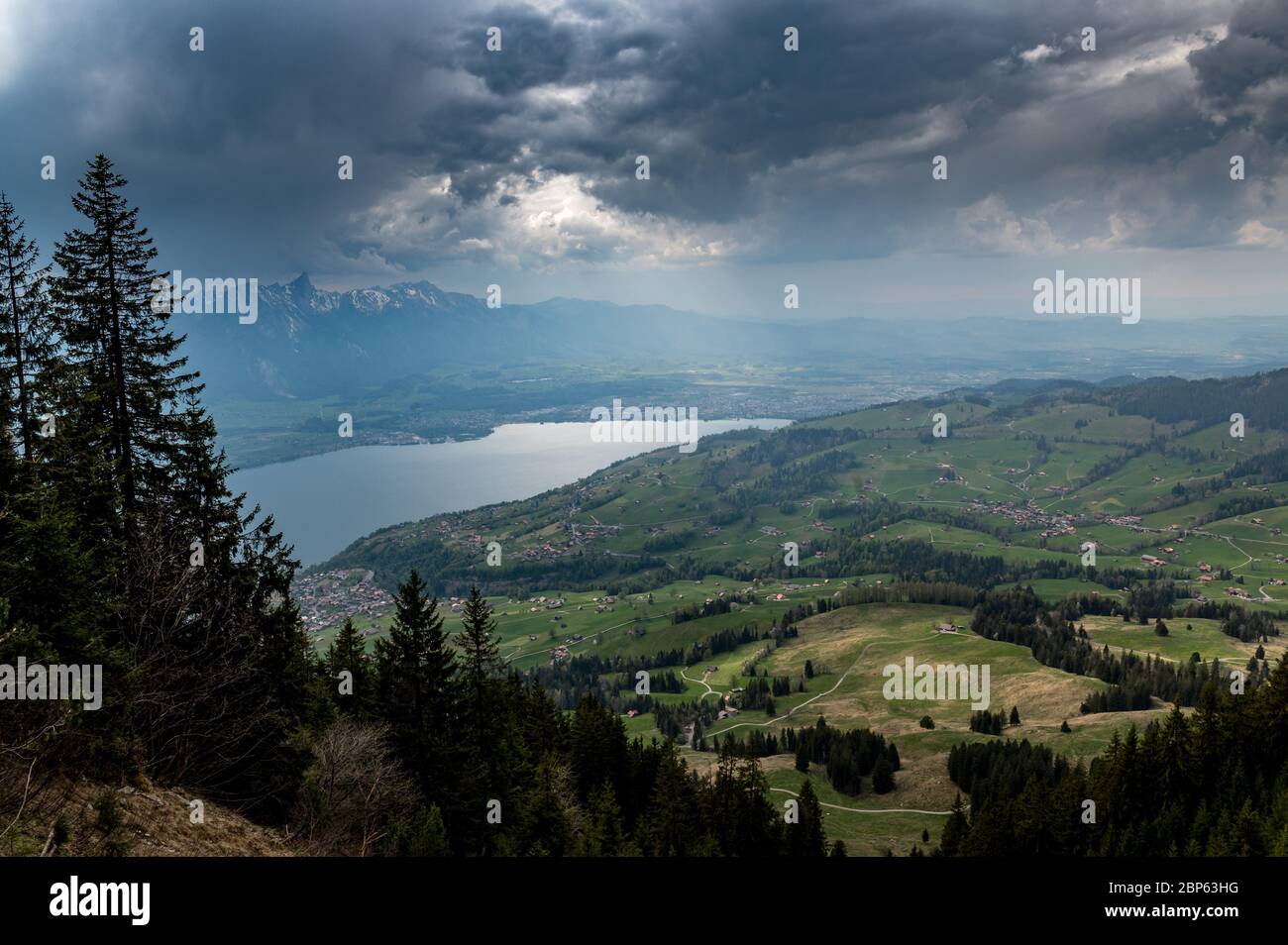 view from Spitzi Flueh over Sigriswil, Thun and Lake Thun with clouds and dramatic light Stock Photo