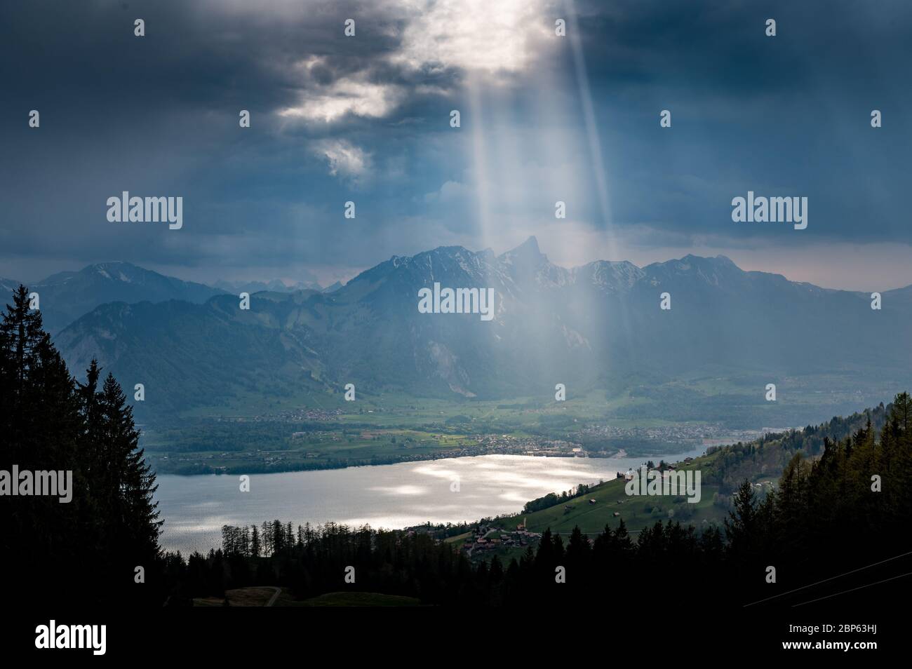 dramatic light on Lake Thun and over Thun seen from over Sigriswil Stock Photo