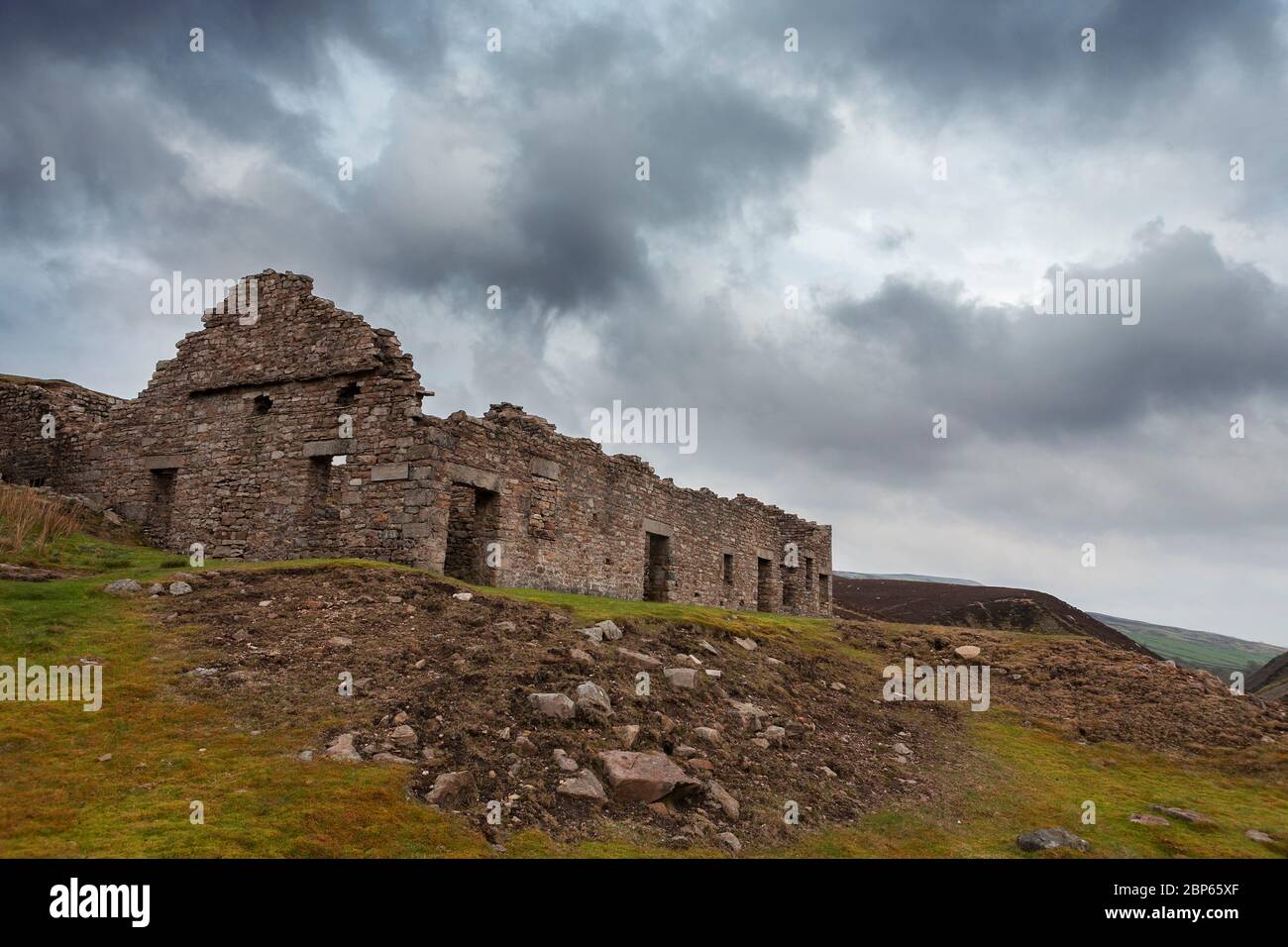 The roofless ruins of Surrender Lead Smelt Mill, Mill Gill, North Yorkshire, England, UK: a scheduled monument and Grade II listed building Stock Photo