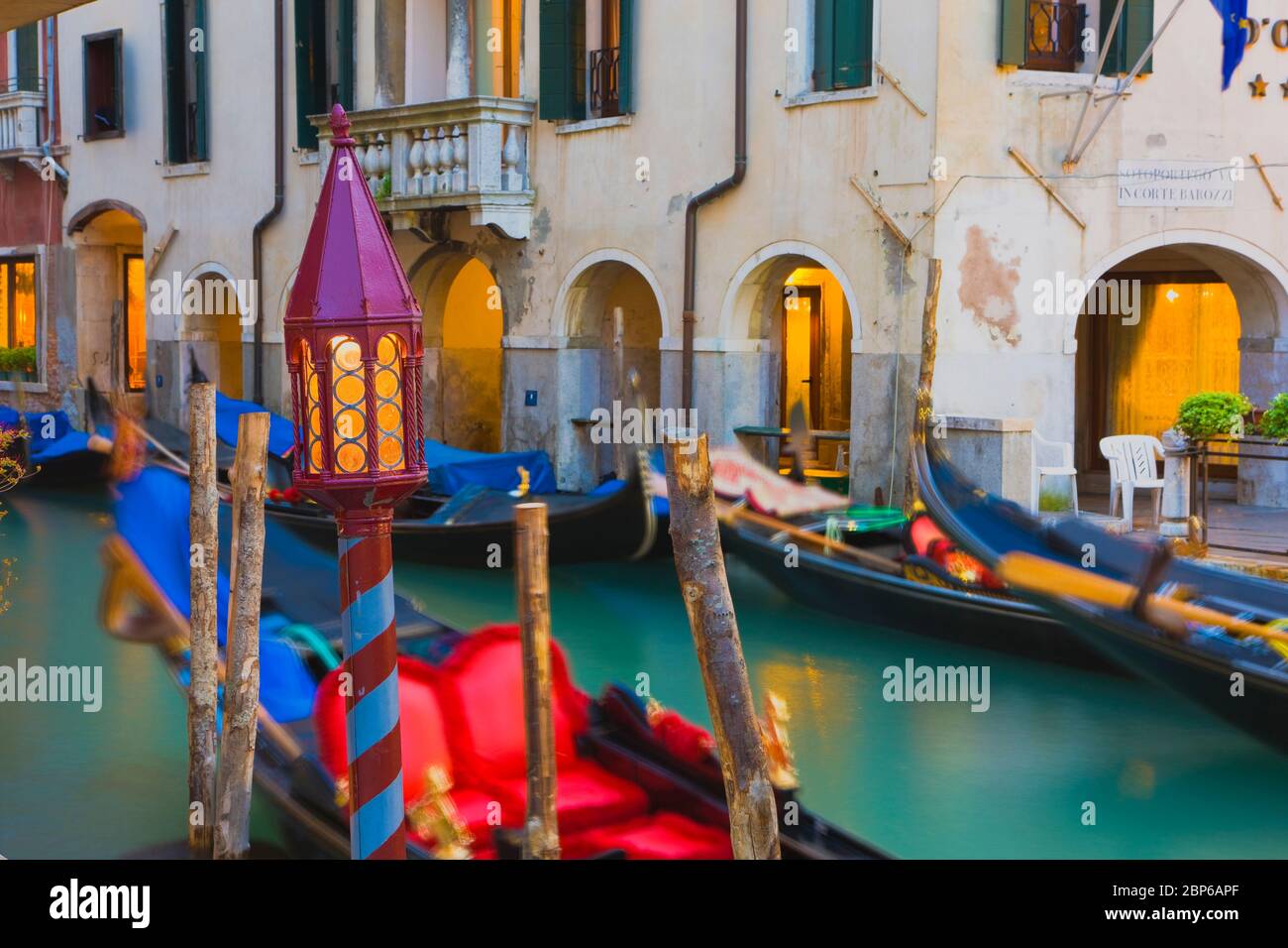 Gondolas on a Canal at dusk, Venice, Italy Stock Photo