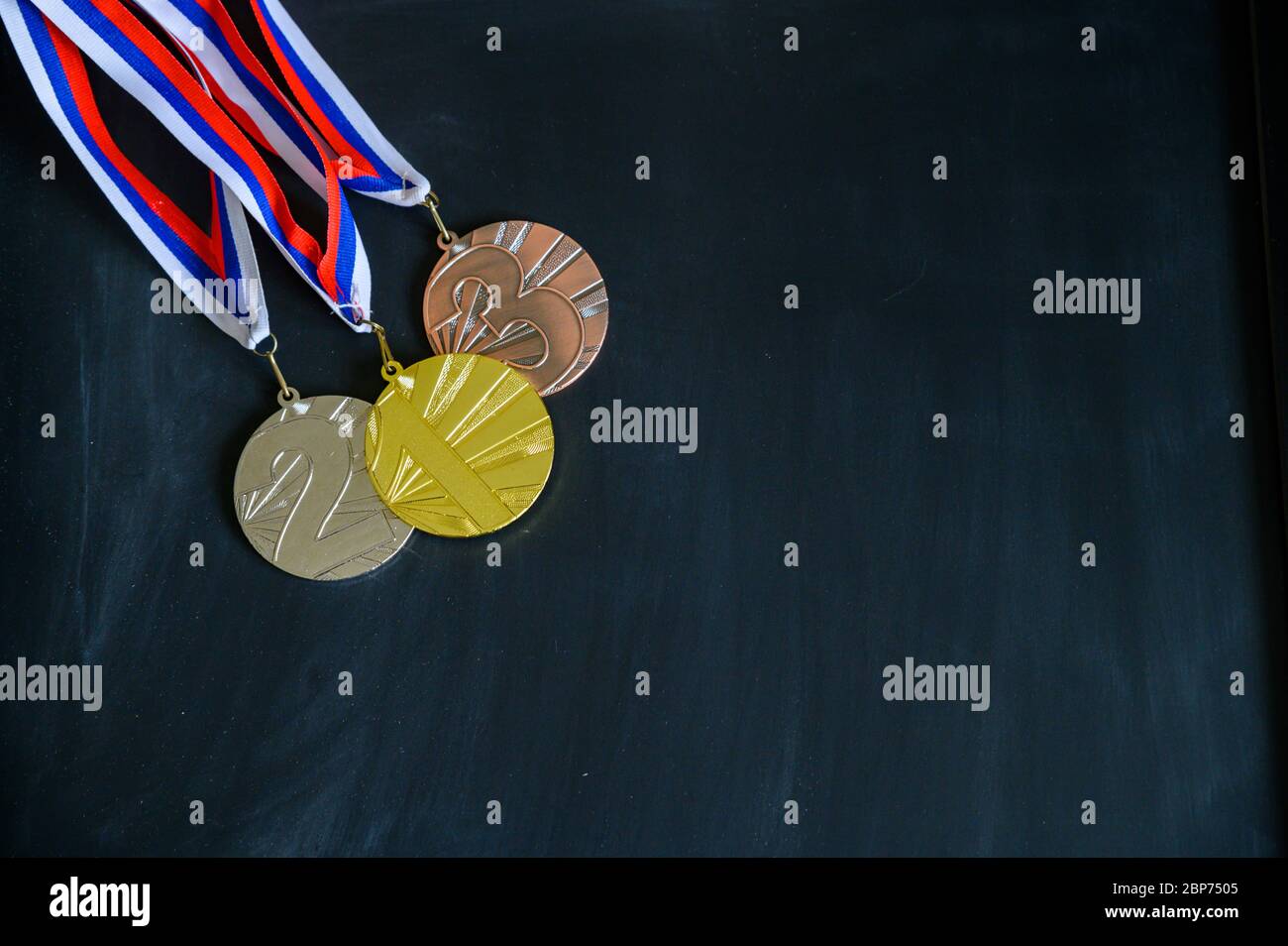 Gold, silver and bronze medal. Medal set on black background, sport photo, black edit space Stock Photo