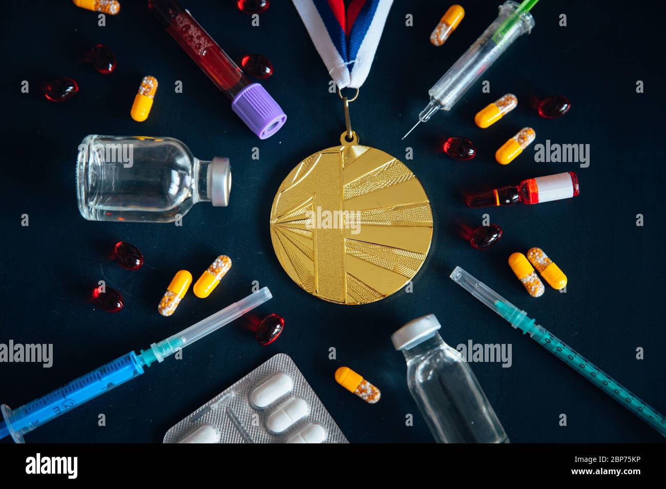 Doping in sport, concept photo. Gold medal, drugs, Medicine bottle for