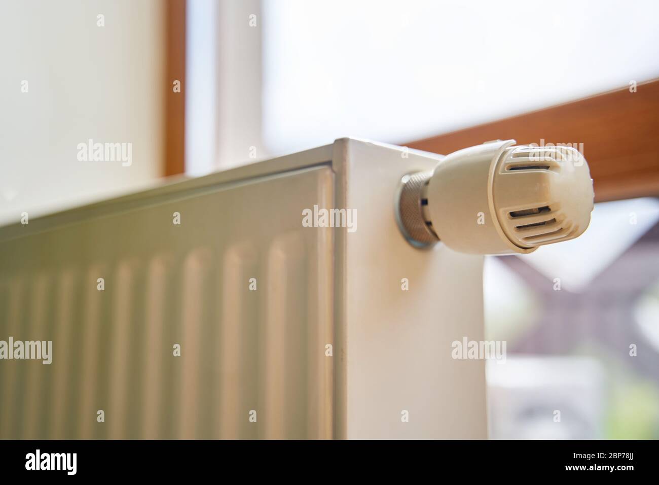 Radiator in the apartment. White heated battery.  Stock Photo