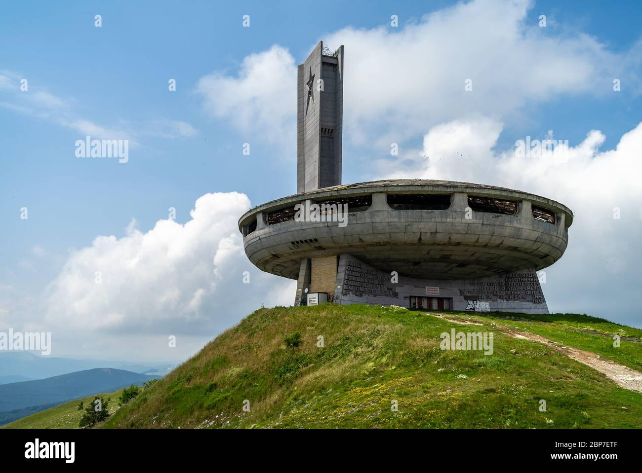 BUZLUDZHA, BULGARIA - JULY 07, 2019: The Monument House of the Bulgarian Communist Party on the Buzludzha Peak of the Balkan mountain range. At the moment, the monument is looted and abandoned. Stock Photo