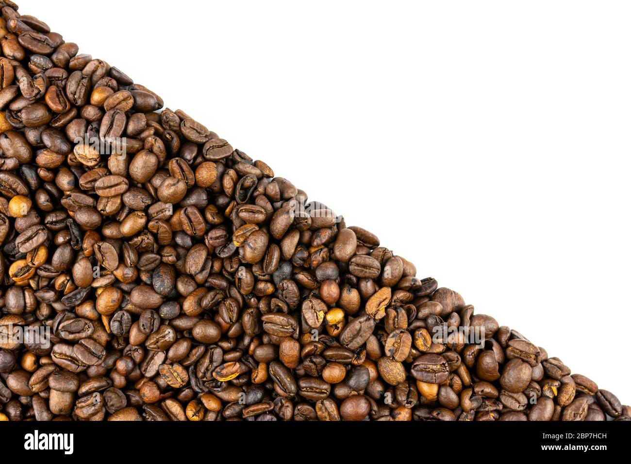 Background made of fresh roasted coffee beans lying flat on a white ...