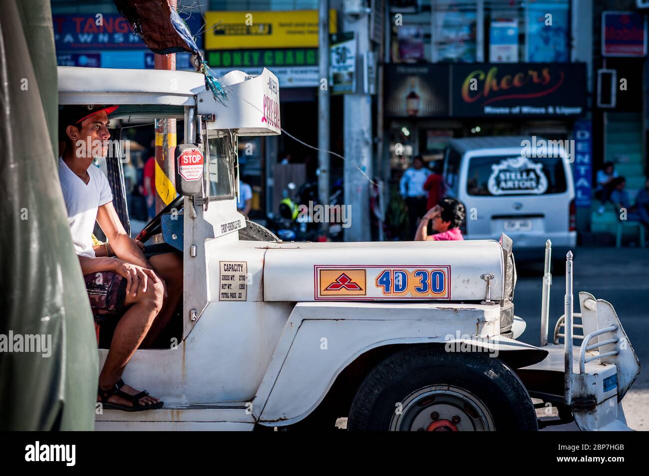A classic jeepney pulls in at the main bus stop in Angeles City, Luzon, Philippines. Stock Photo