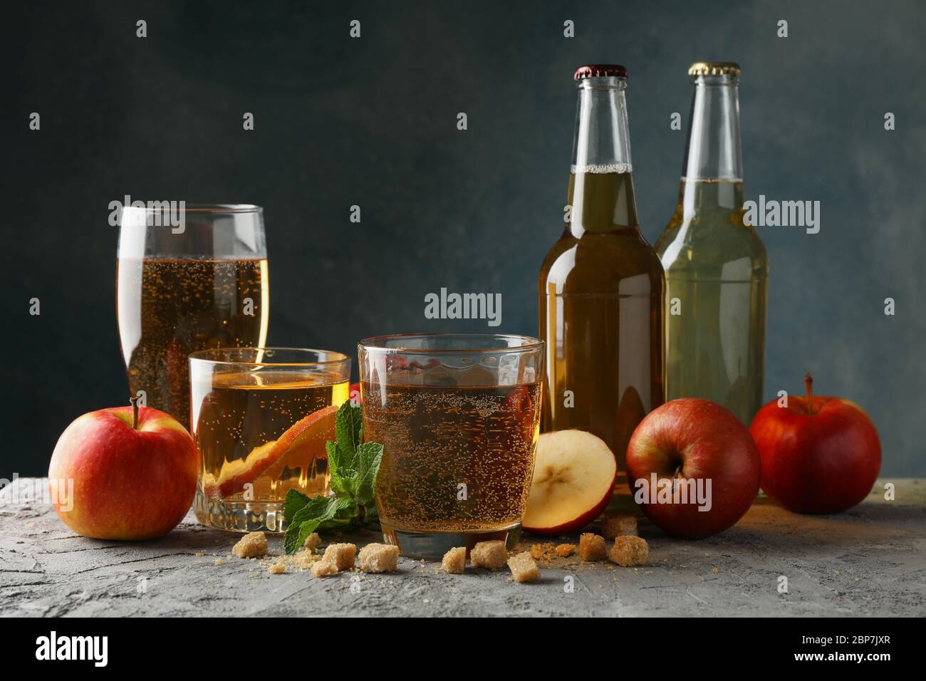 Composition with cider, sugar and apples on gray background Stock Photo