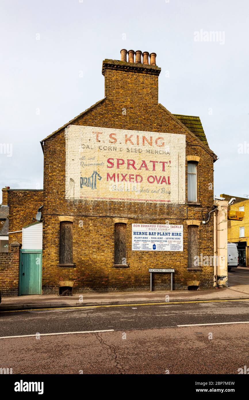 T S King coal merchants in Herne Bay. Painted wall signs show how things  have changed. Kent, UK Stock Photo - Alamy