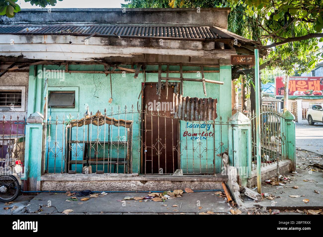 An old house once used as a laundry shop in ruin in Angeles City Philippines. Stock Photo