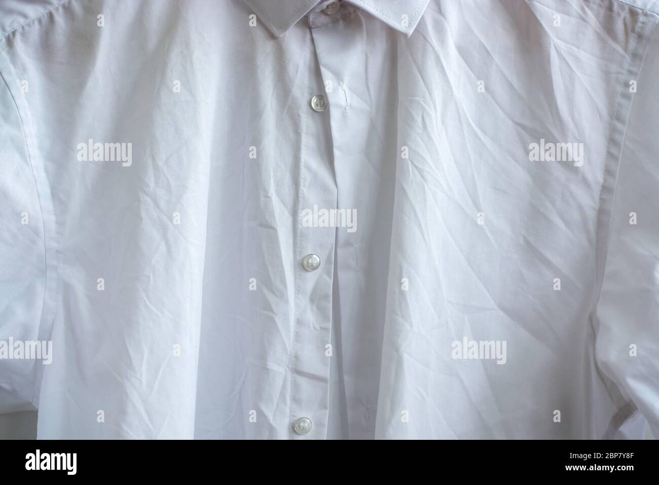 Wrinkled white classic long sleeve mens shirt Stock Photo