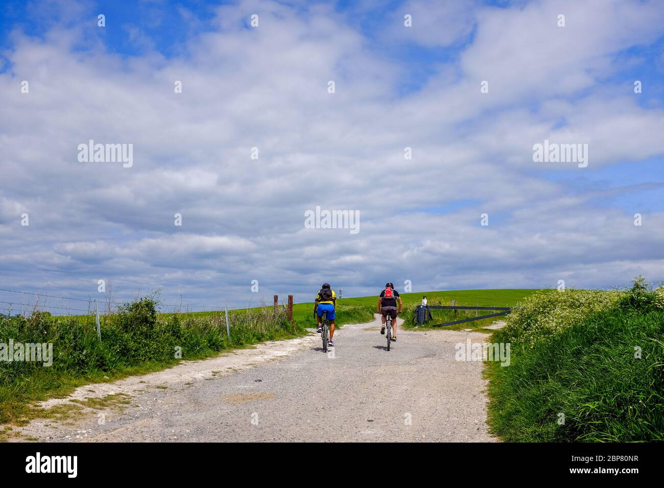 Woodingdean Brighton UK - Cyclists on a rough path track across the South Downs Stock Photo