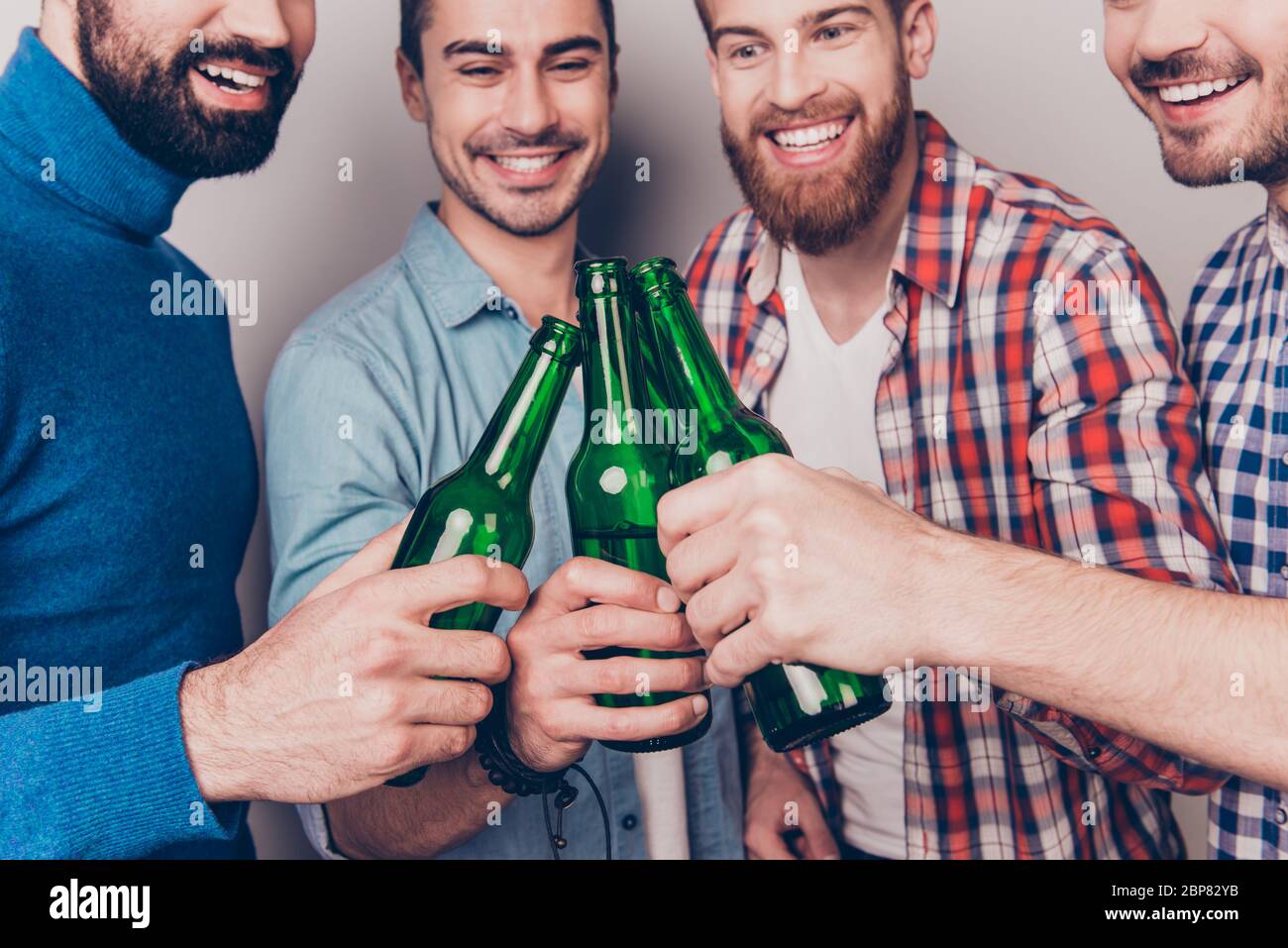 Handsome guys clinking bottles hi-res stock photography and images - Alamy