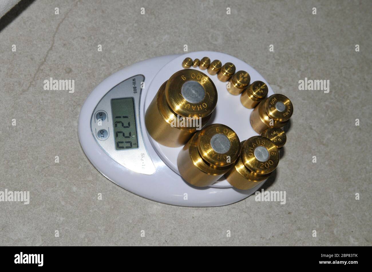 Precision weights of different value and a digital scale Stock Photo