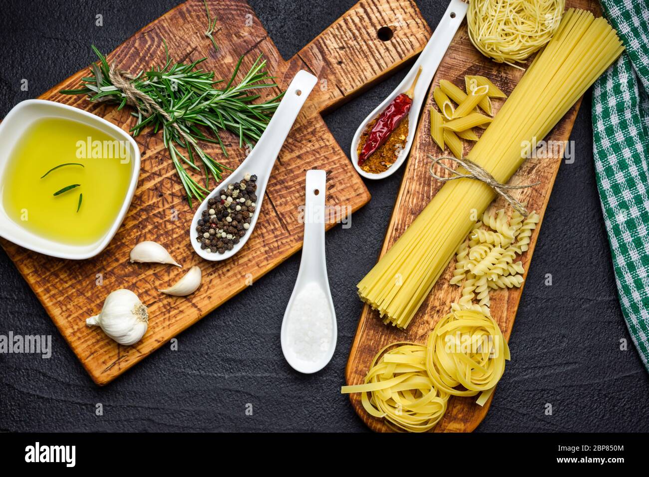 Ingredients for Italian cooking, pasta, herb, spices and olive oil on