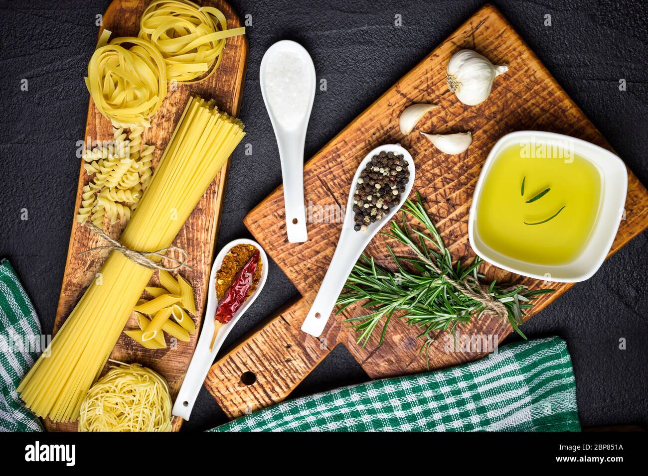 Ingredients for Italian cooking, pasta, herb, spices and olive oil on