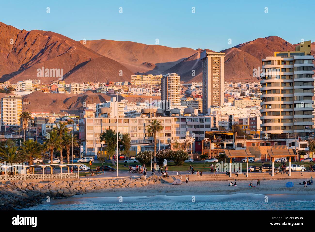 Antofagasta, Region de Antofagasta, Chile - Skyline of buildings and people at the boulevard at the side of the beach. Stock Photo
