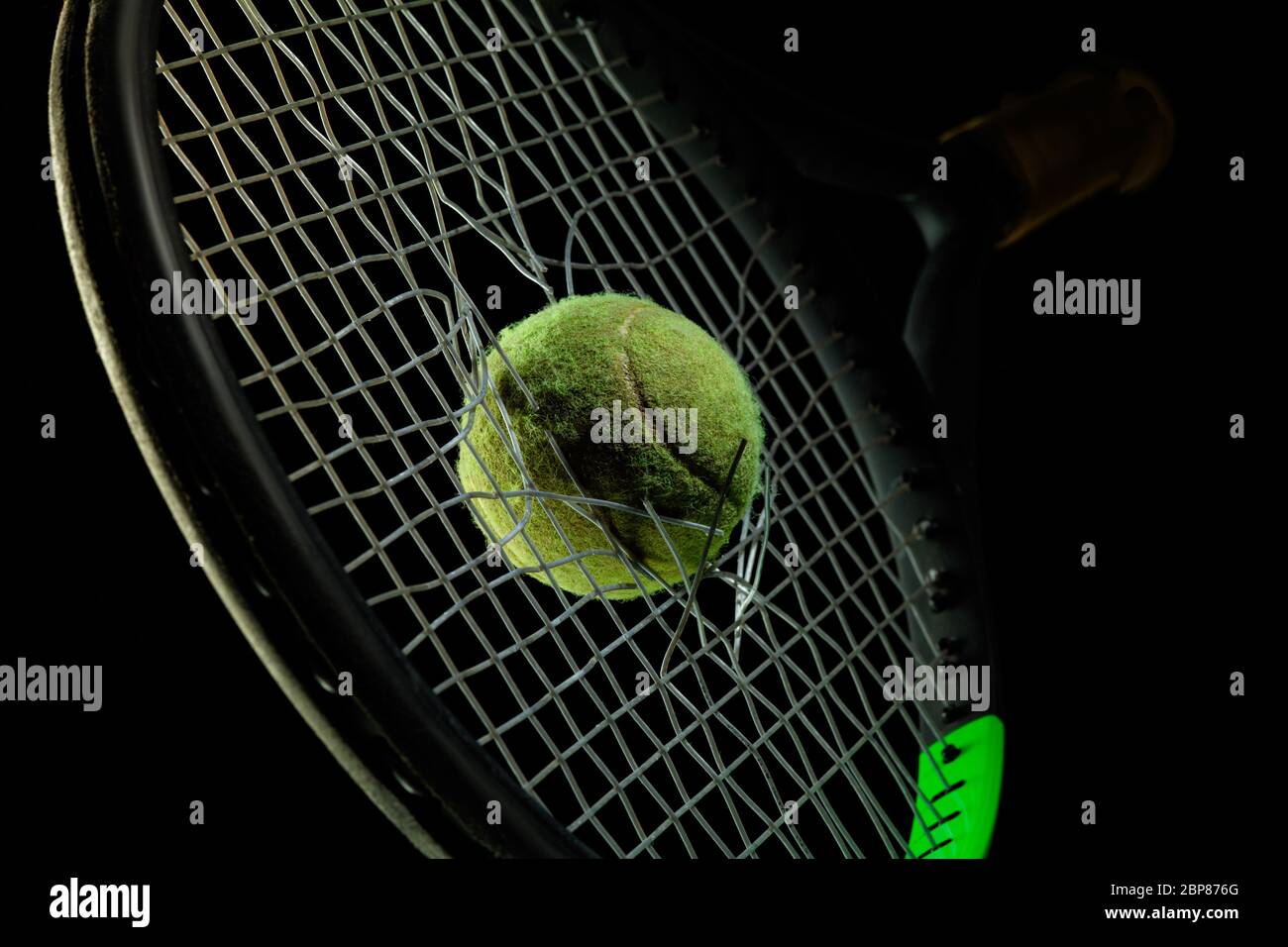Tennis racket, ball. Professional sport equipment isolated on black