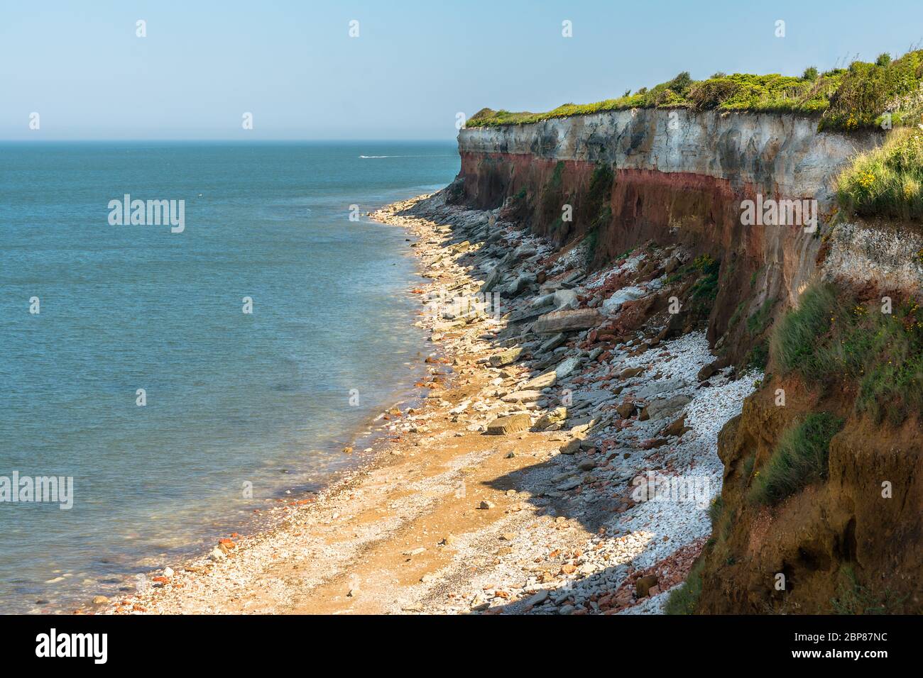 eroding cliffs of Hunstanton with different coloured rocks. Stock Photo