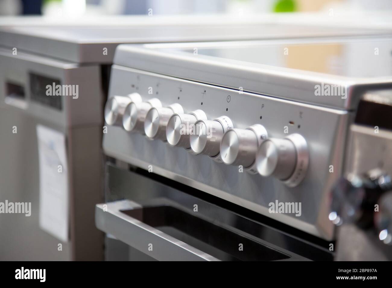 handles of a gas or electric stove, closeup, side view, soft focus