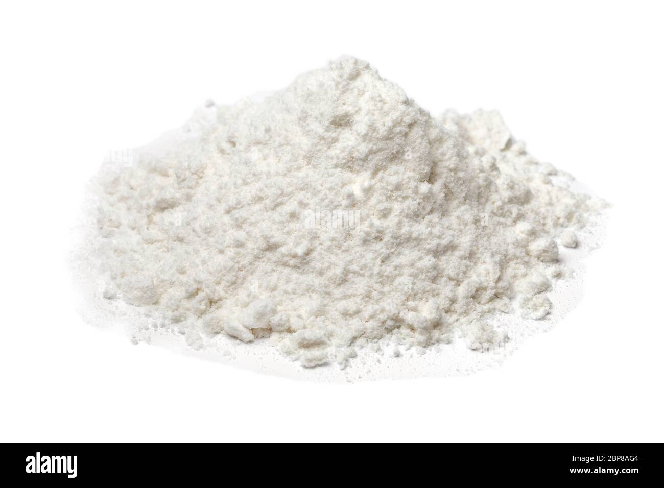 Heap of white wheat flour close up  isolated on white background Stock Photo