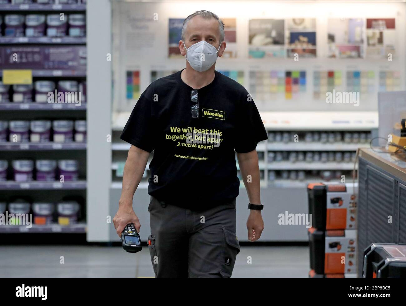 An employee of Woodie's DIY store in Bray, Co. Wicklow, as phase one of