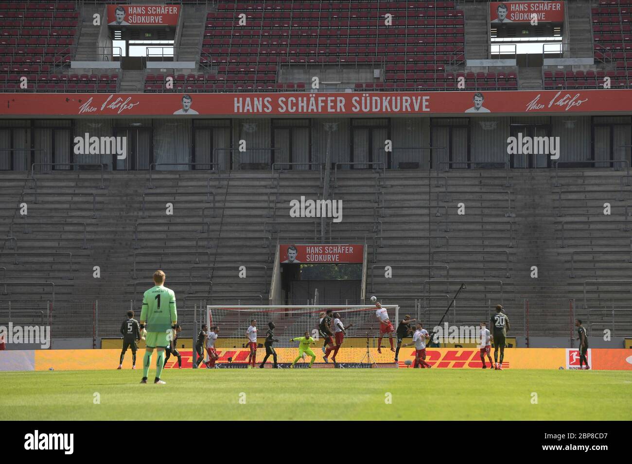 general game scene against a ghost backdrop. Empty stadium, empty ranks, penalty area scene in front of the Hans Schaefer Suedkurve, Schvssfer Svºdkurve, fan curve, action, football 1.Bundesliga, 26.matchday, FC Cologne (K) - FSV FSV FSV Mainz 05 2: 2, on May 17, 2020 in Cologne/Germany. Photo: Anke Waelischmiller/SVEN SIMON/Pool For journalistic purposes only! Only for editorial use! According to the requirements of the DFL Deutsche Fuvuball Liga, it is prohibited to use or have photos taken in the stadium and/or photos taken by the game in the form of sequence pictures and/or video Stock Photo