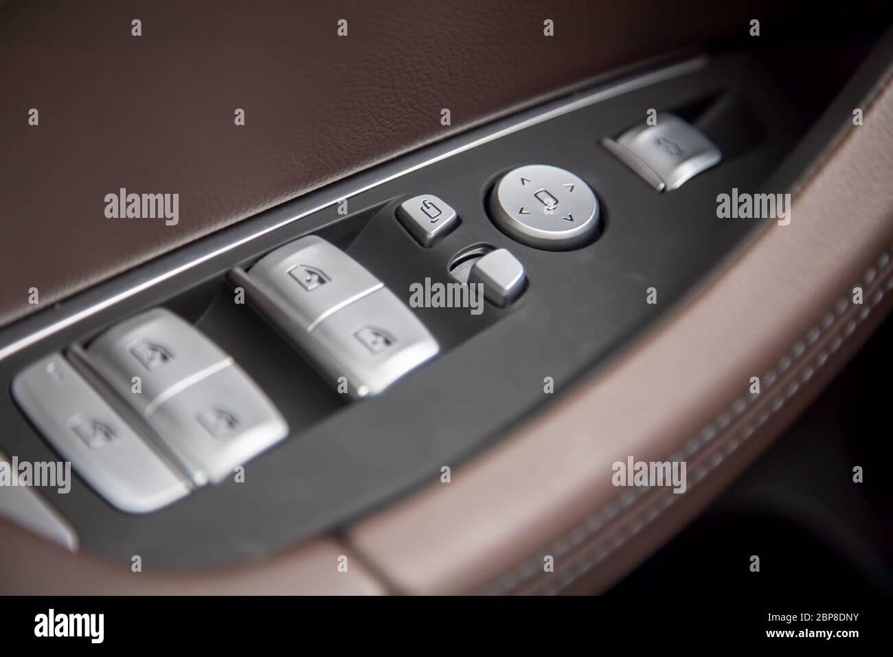 Car brown Leather Interior Details Of Door Handle With Windows and