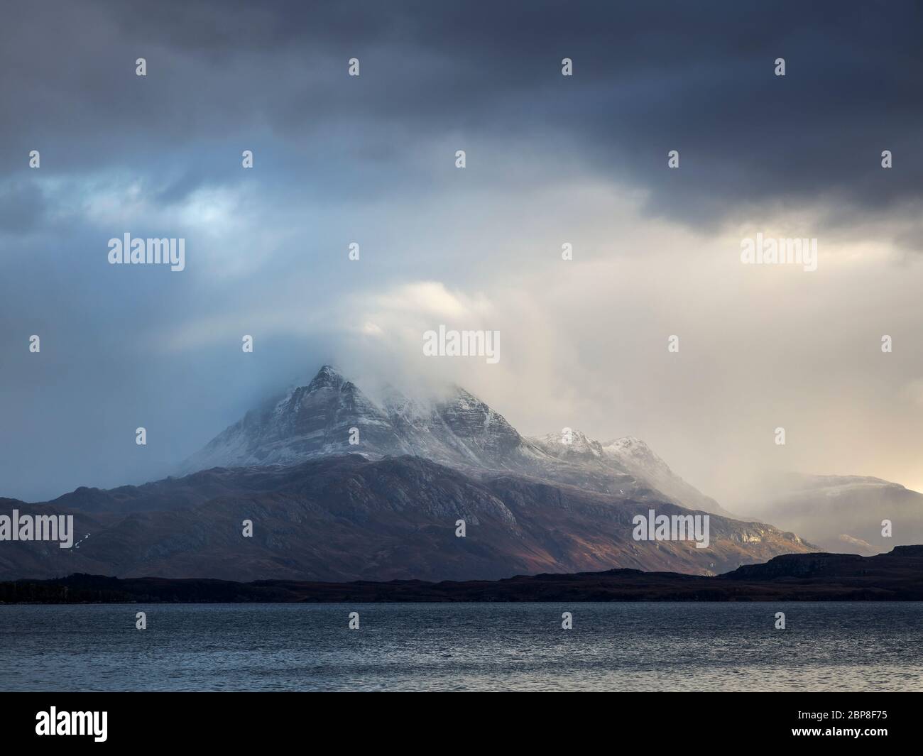 The mountain Slioch emerges from the cloud, Loch Maree, Wester Ross, Scotland Stock Photo