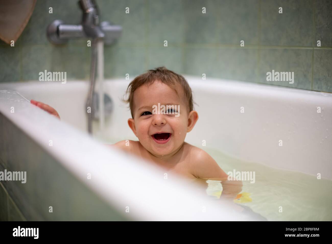 concept of family happiness. home fun. Cute Caucasian baby taking a