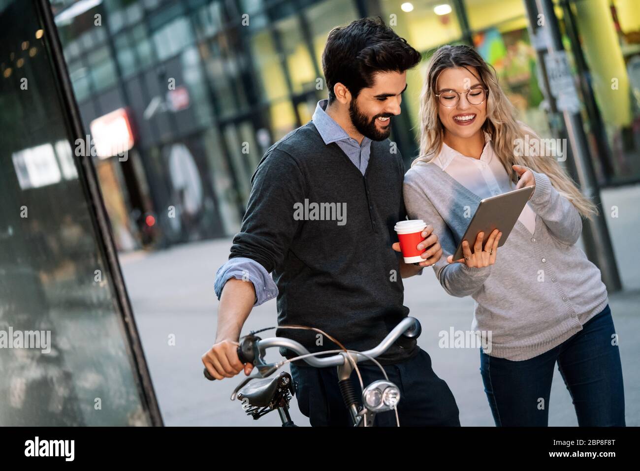 Happy young couple using a digital tablet together and smiling Stock ...