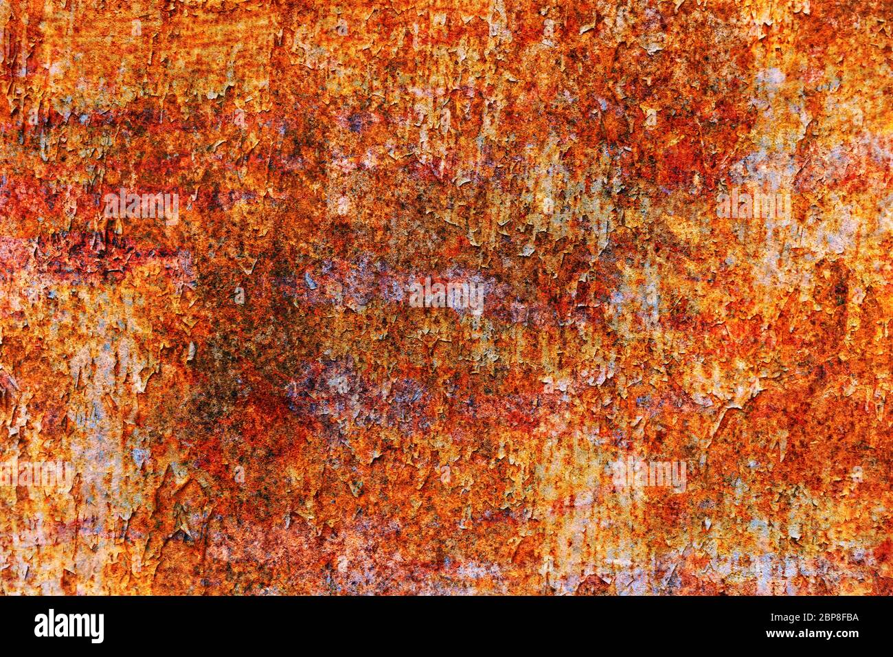 Grunge metal coroded texture. Old rusty metal plate heavily aged corrosion stain creates a grungy frame. Stock Photo