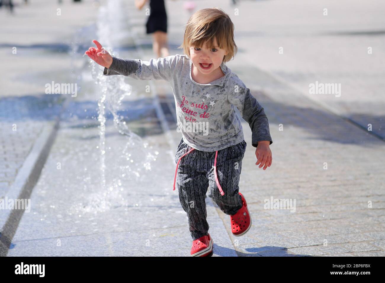 Brussels, Belgium. 18th May, 2020. A child plays outdoors in Brussels, Belgium, May 18, 2020. Belgium on Monday entered Phase-2 deconfinement with schools reopening to some grades under strict organizational conditions. Credit: Zhang Cheng/Xinhua/Alamy Live News Stock Photo