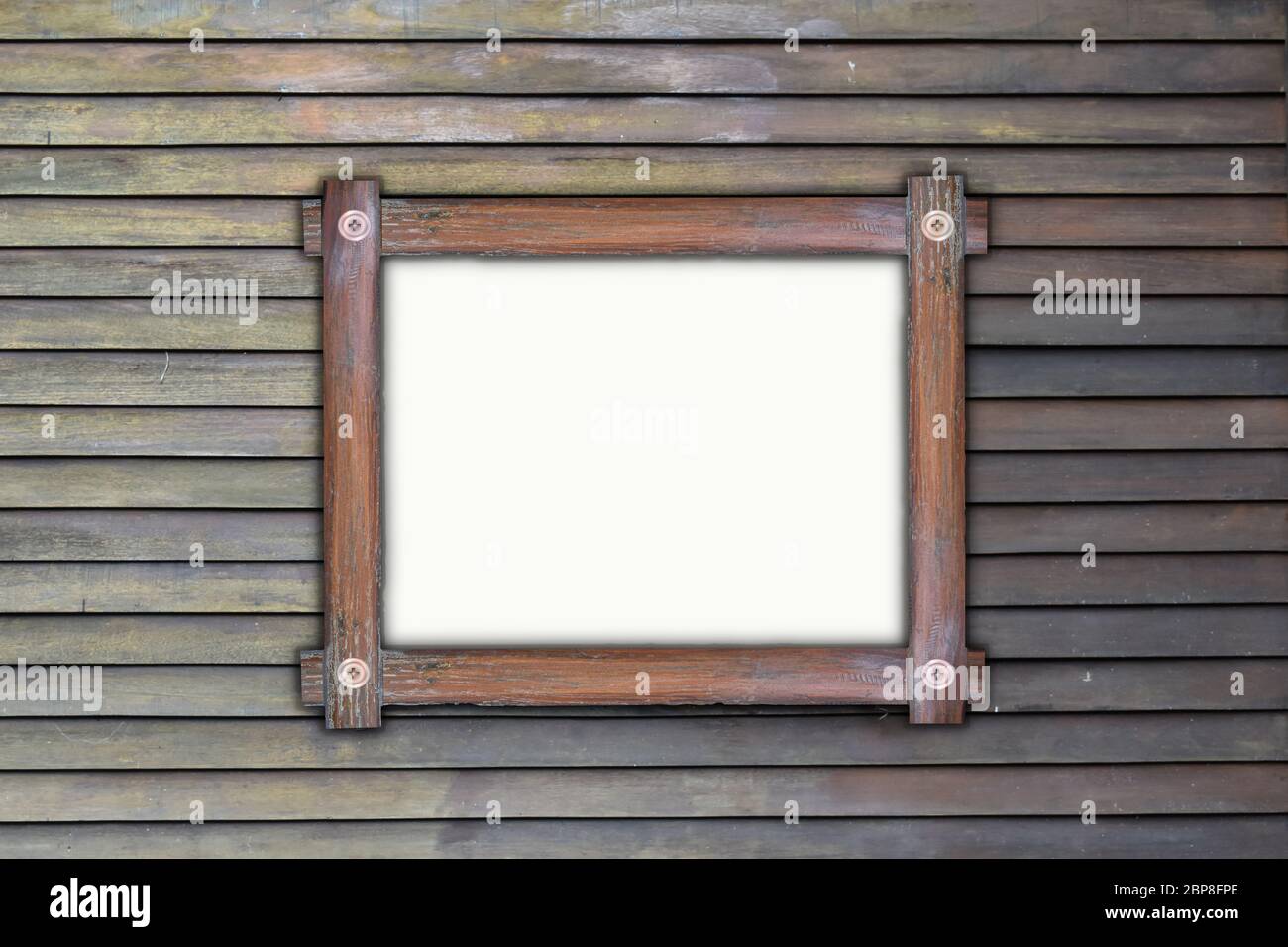 Empty wooden frame, hanging on wood panels background. Retro style design Stock Photo