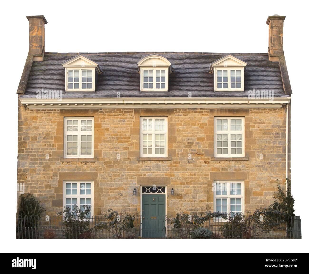 Cut-out Cotswold house on white background. Stock Photo