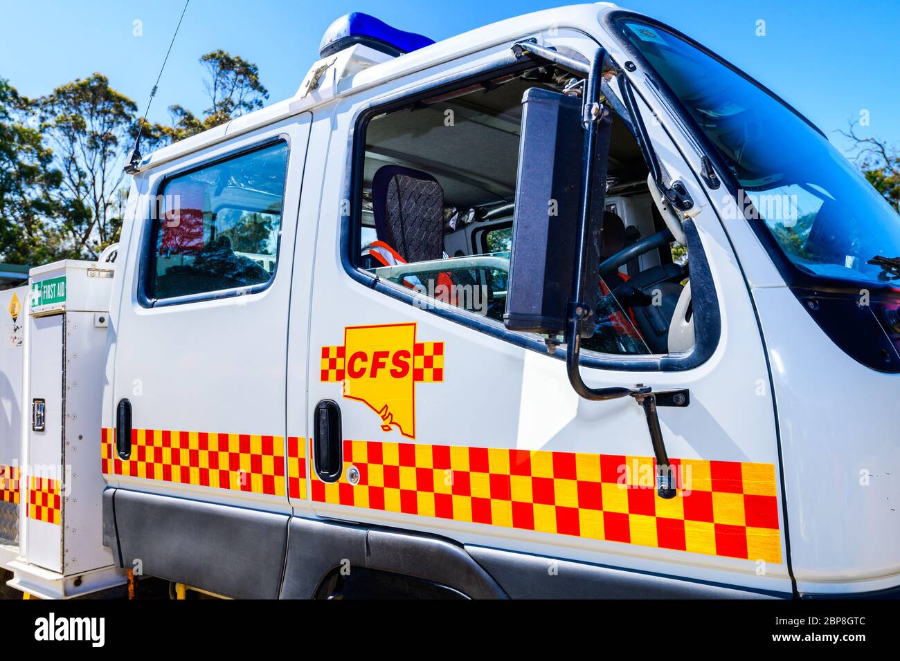 Adelaide Hills, South Australia - February 9, 2020: South Australian Country Fire Service truck door fragment with CFS logo in the centre on a bright Stock Photo
