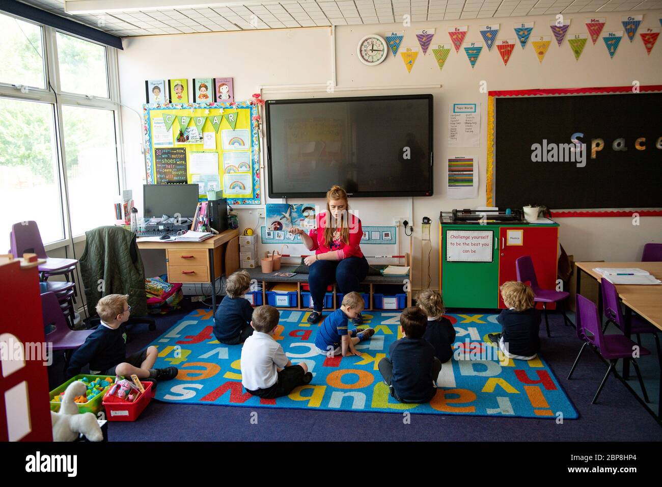 Children of essential workers socially distance whilst in lesson at Kempsey Primary School in Worcester. Nursery and primary pupils could return to classes from June 1 following the announcement of plans for a phased reopening of schools. Stock Photo