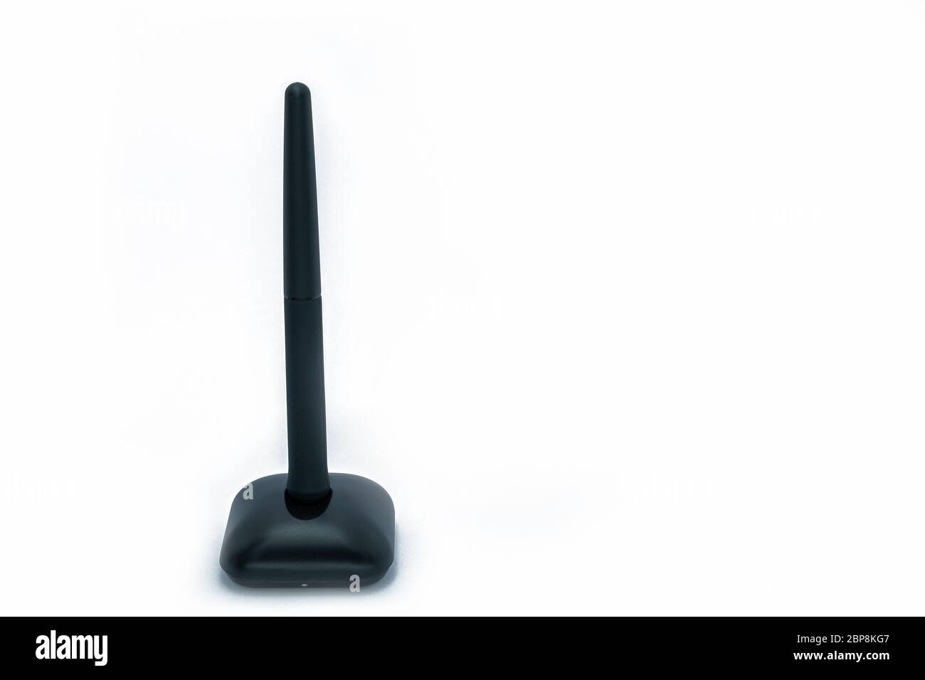 Wireless pen mouse on stand for using with computer, side and front on isolated white background. Stock Photo