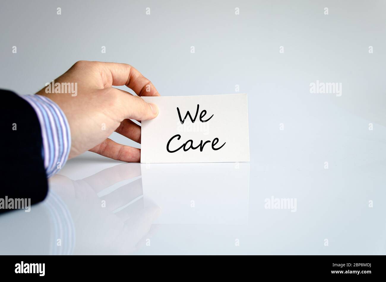 We care text concept isolated over white background Stock Photo