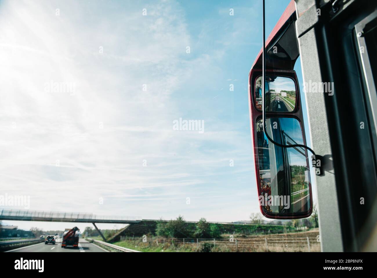 rear-view mirror in the bus riding the european roads of Europe Stock ...