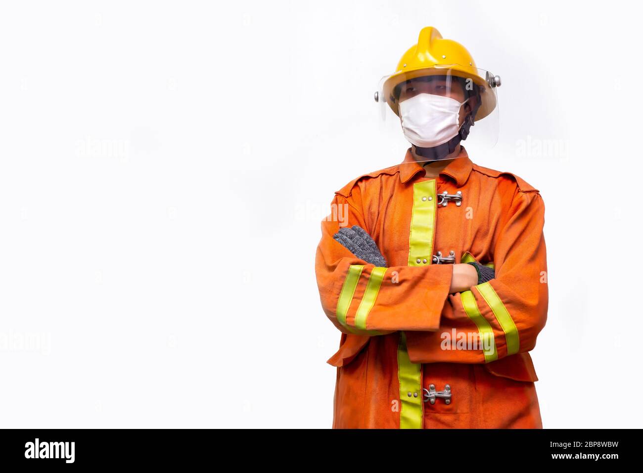 Firefighter rescue, fireman standing portrait isolated on white background. Stock Photo