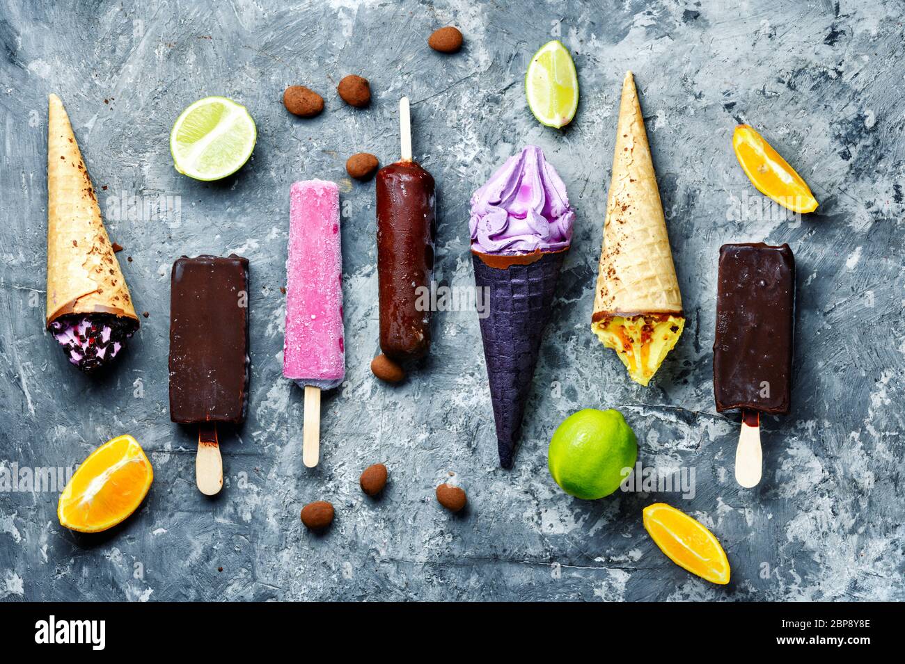 Different types of ice cream in a waffle cone and popsicle.Assorted ice