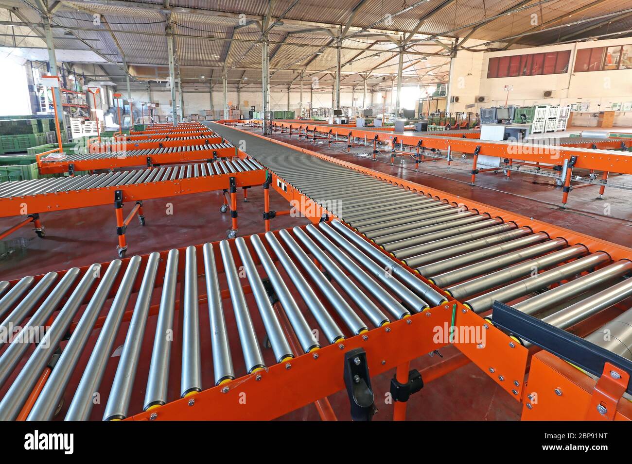 Long Conveyor Sorting System in Distribution Warehouse Stock Photo - Alamy