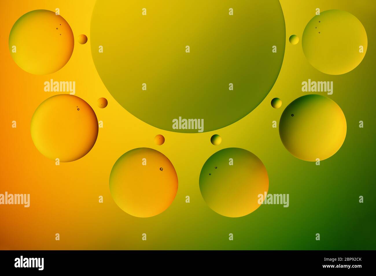 Multicolored decorative circles on bright gradient background. Stock Photo