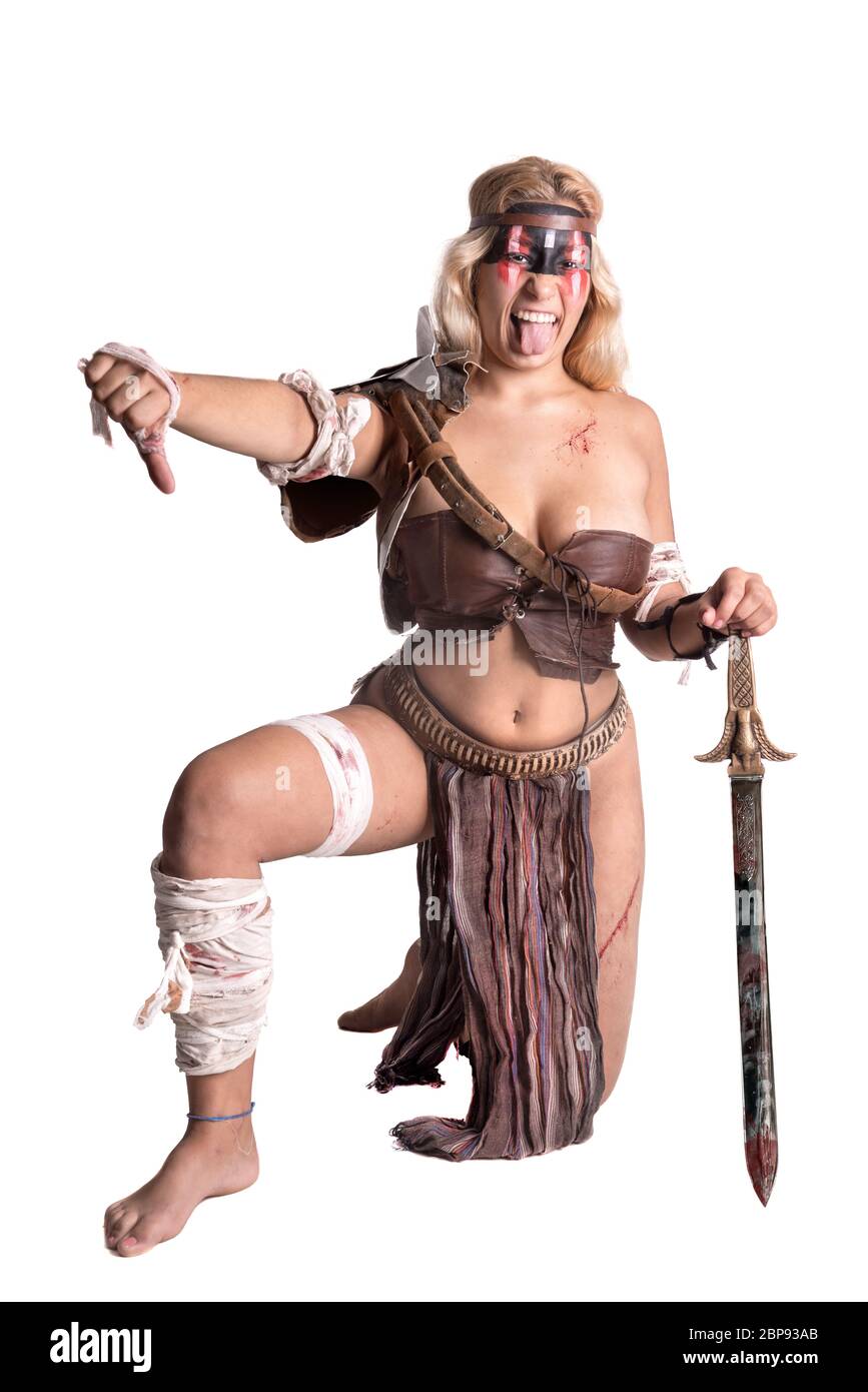 Ancient woman warrior or Gladiator posing with sword, isolated in white Stock Photo