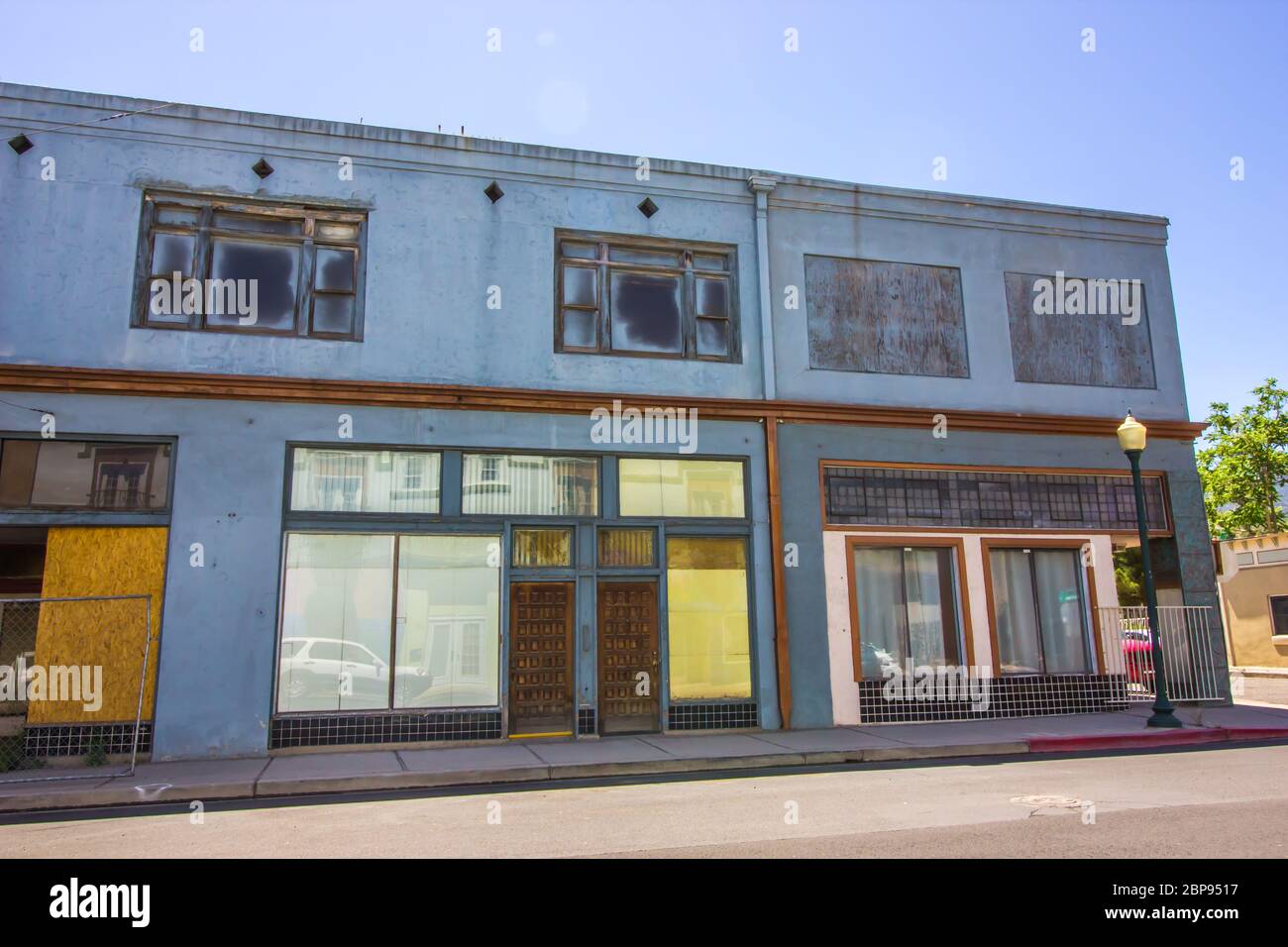 Vacant Retail Storefronts With Boarded Up Windows Stock Photo