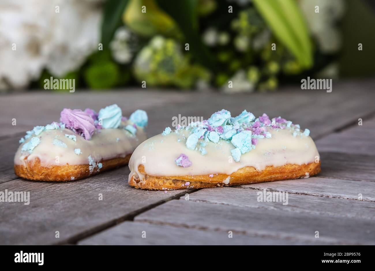 Traditional french eclairs is typically piped into an oblong shape with