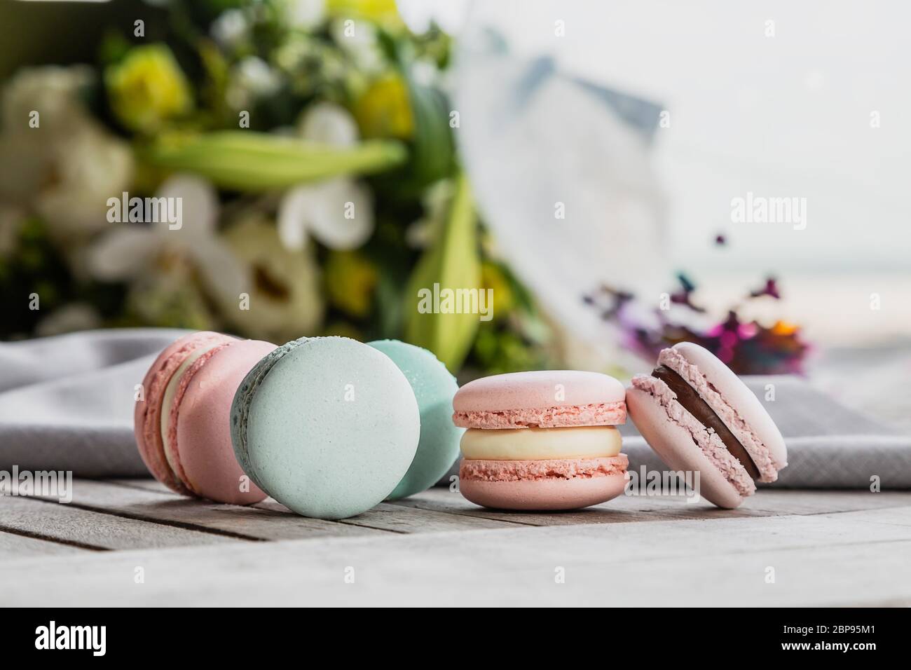 Homemade Fresh Colorful French macarons cake, on natural concrete wooden background. Food concept with copy space. Horizontal image Stock Photo